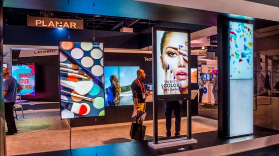 Two digital signs promoting cosmetics in Shopfront of retail store in Parammatta